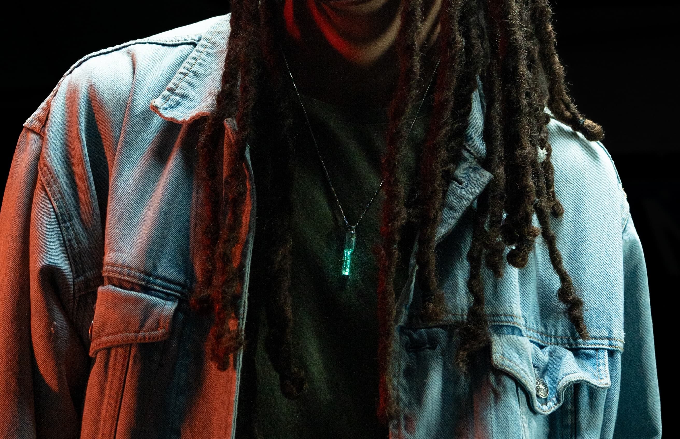 Spire Pendant worn on layered outfit